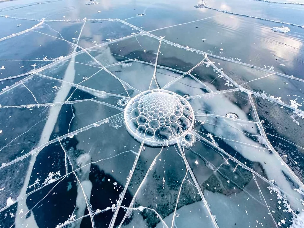 Methane bubble trapped in clear ice visible from above