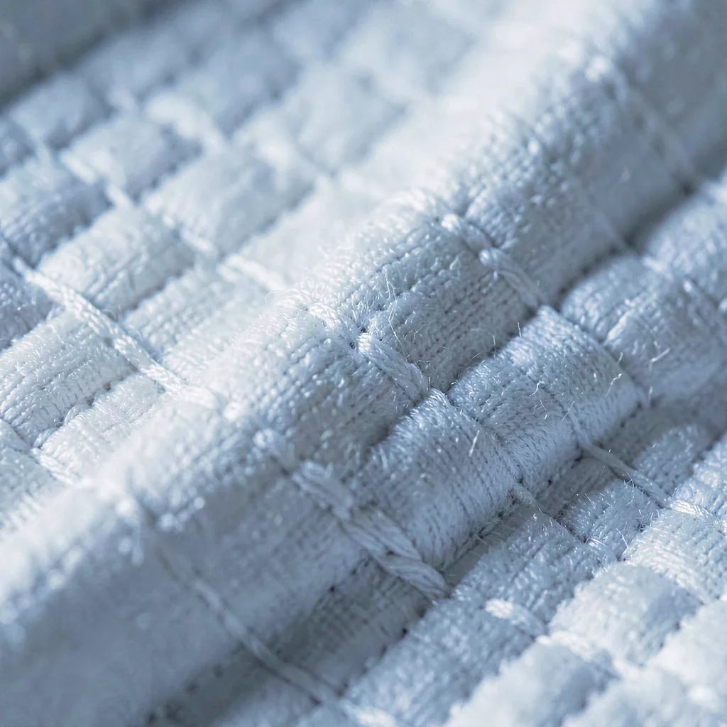 Mineral macro of cotton percale weave, fine threadcount detail under cool raking