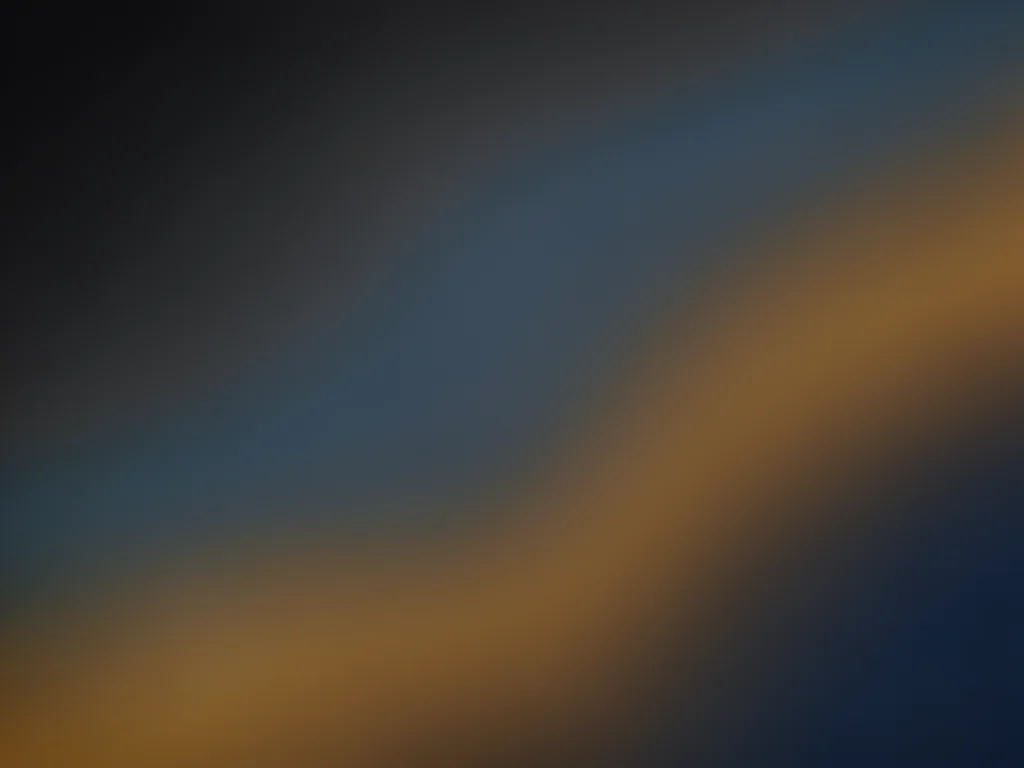 A storm gradient: charcoal grey through slate blue to a break of warm amber, dra
