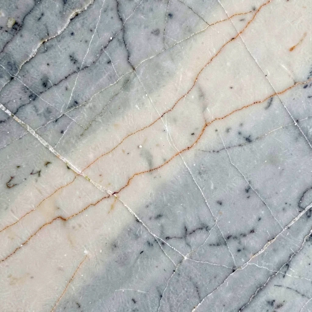 Zoom-background of an abstract gradient cut from a single slab of veined marble,