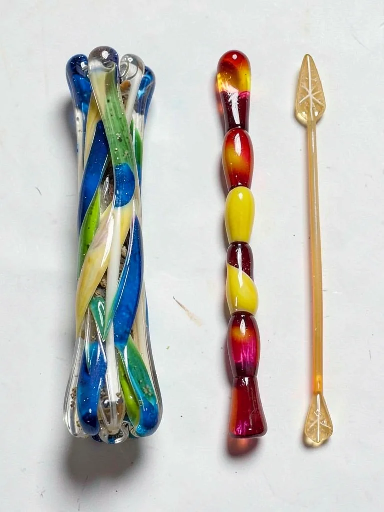Partially pulled glass cane — thick bundle end and thin stretched end side by si