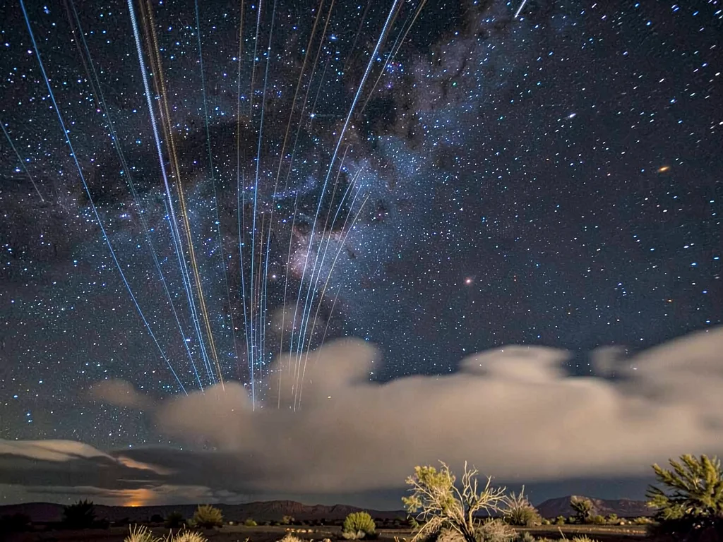 Trails through thin cloud creating glow