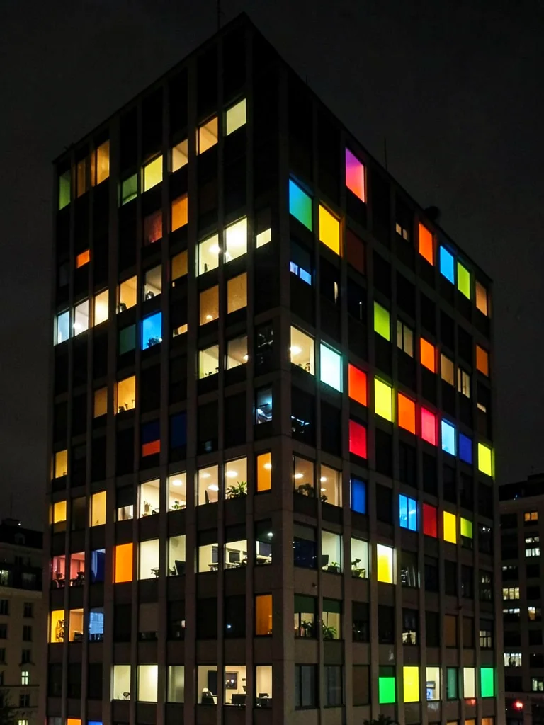 Office building at night, random lit windows making unintentional Mondrian