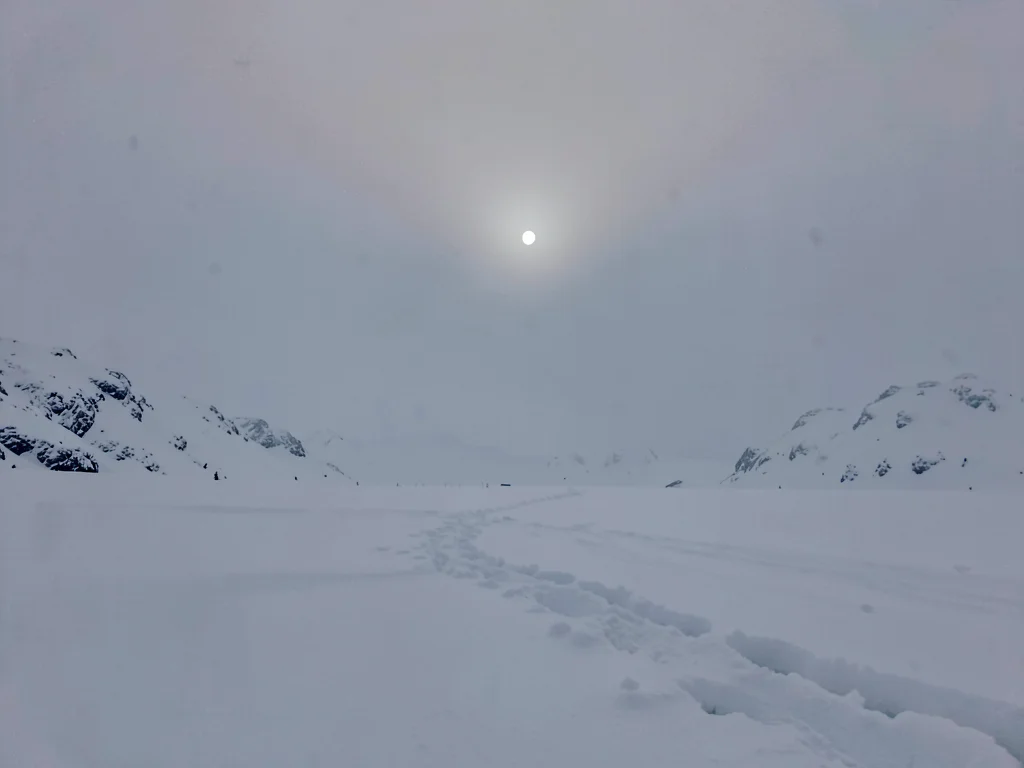 Moon rise over all white landscape