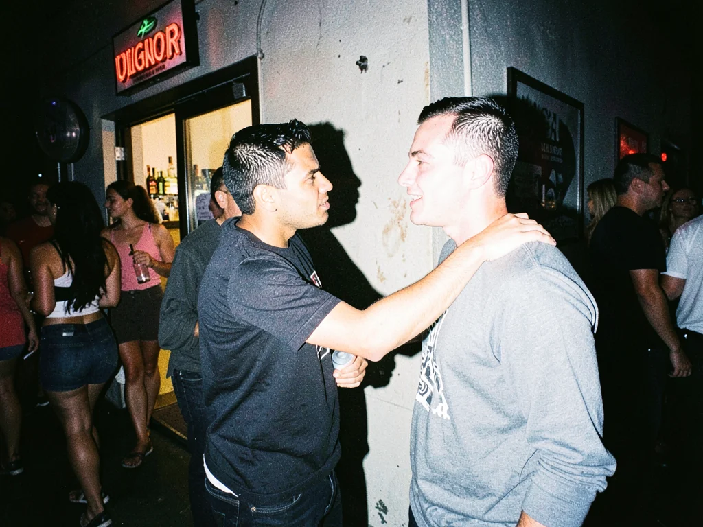 Couple arguing outside club