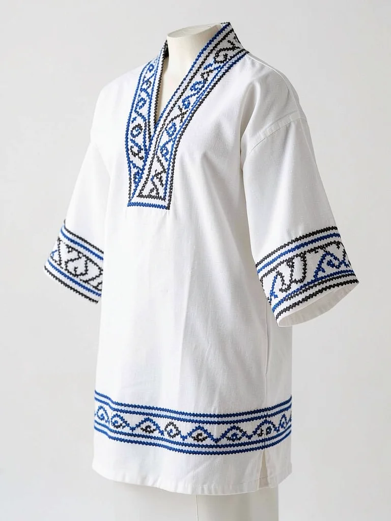 Ainu robe in three-quarter view — geometric border bands at collar, sleeves, and