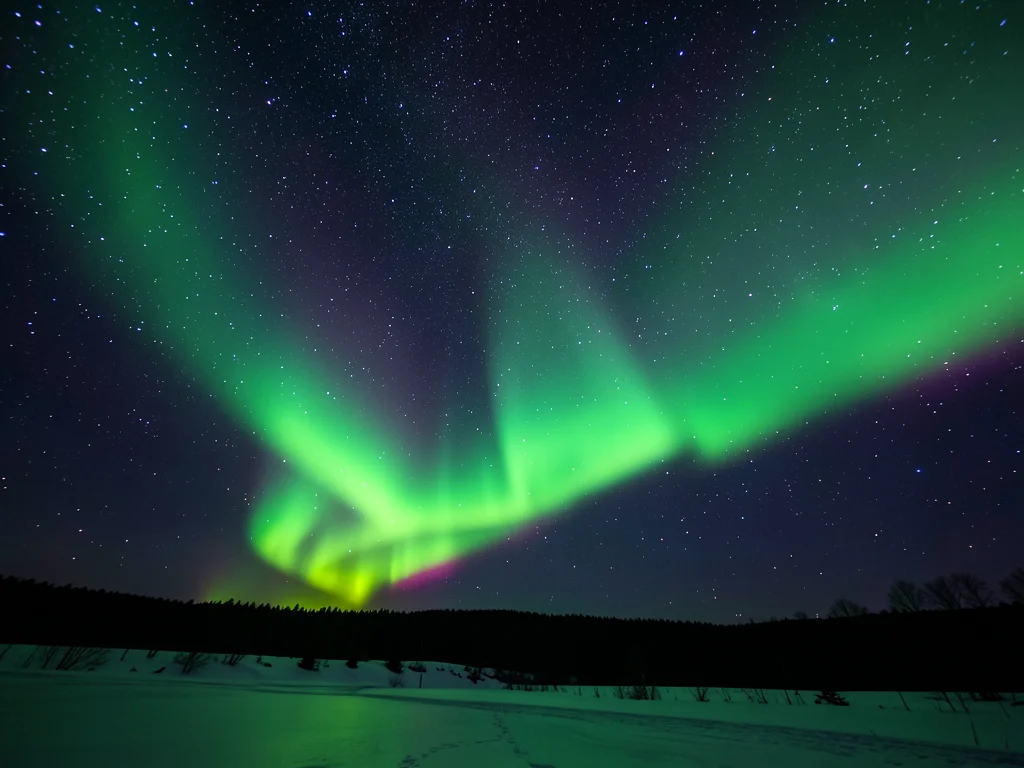 Aurora and star field, green curtain transparent enough to see stars shining thr