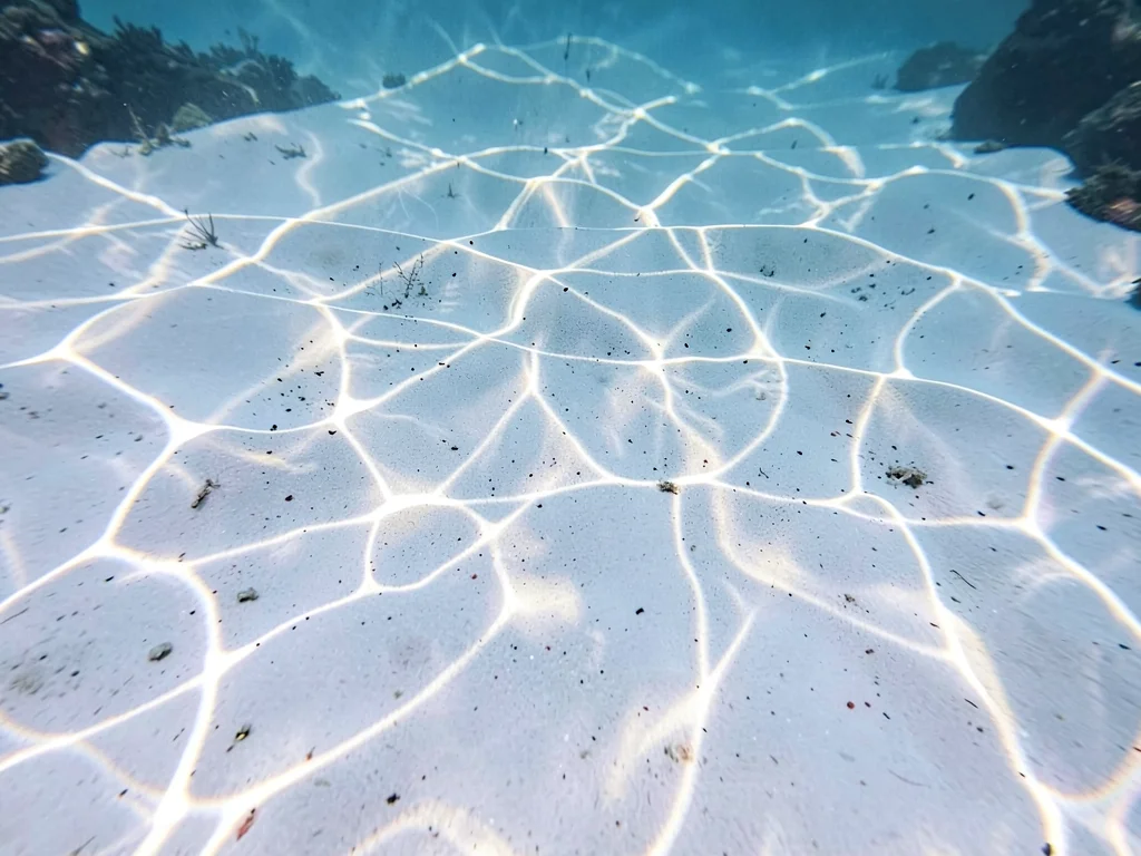 Light pattern frozen at fast shutter on pure white sand