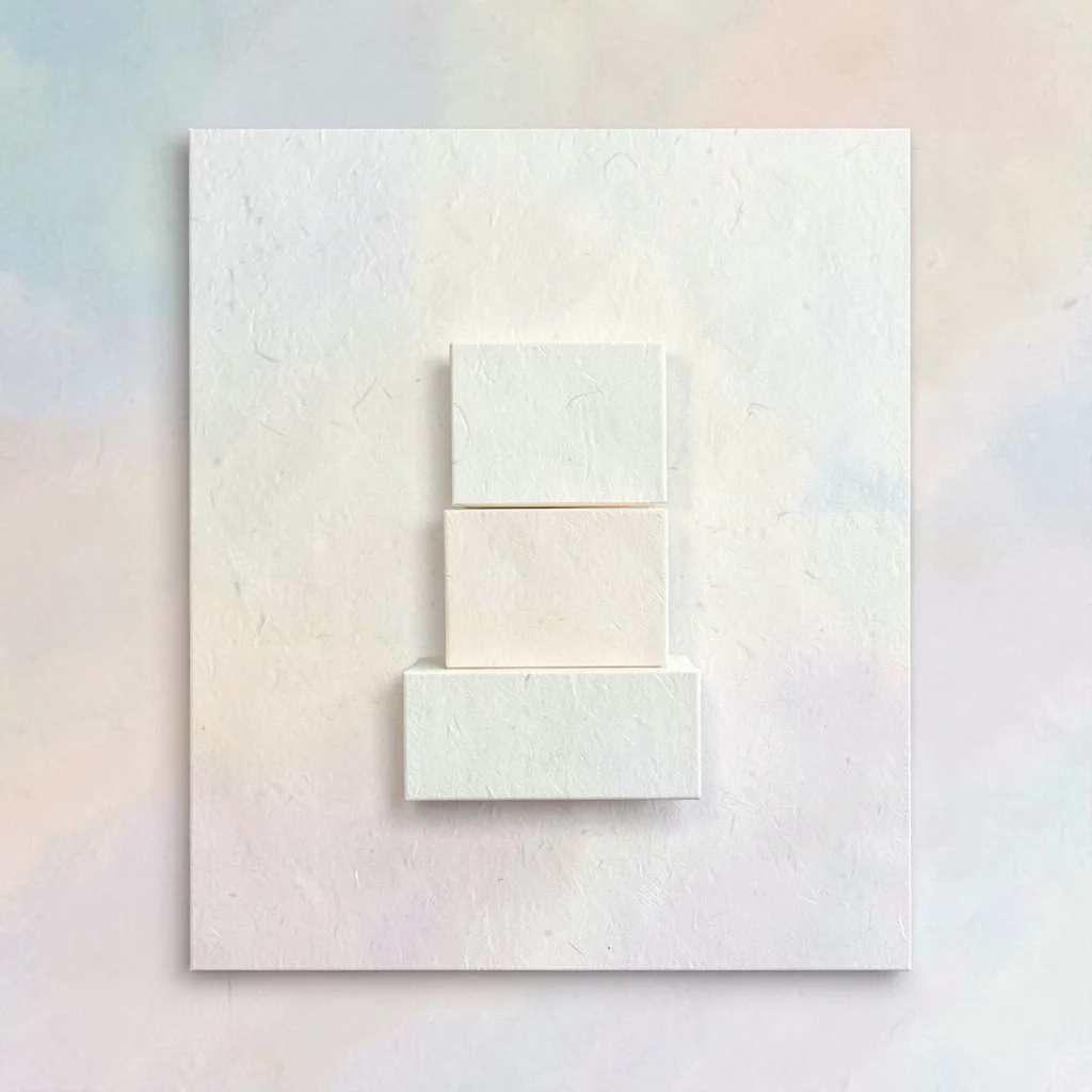 Card with three stacked cream blocks suggesting savings tiers, paper grain visib
