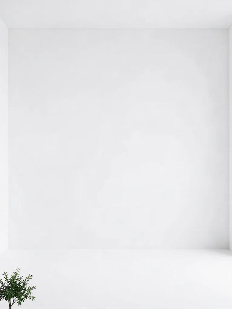 Small plant at bottom corner of enormous white minimalist interior
