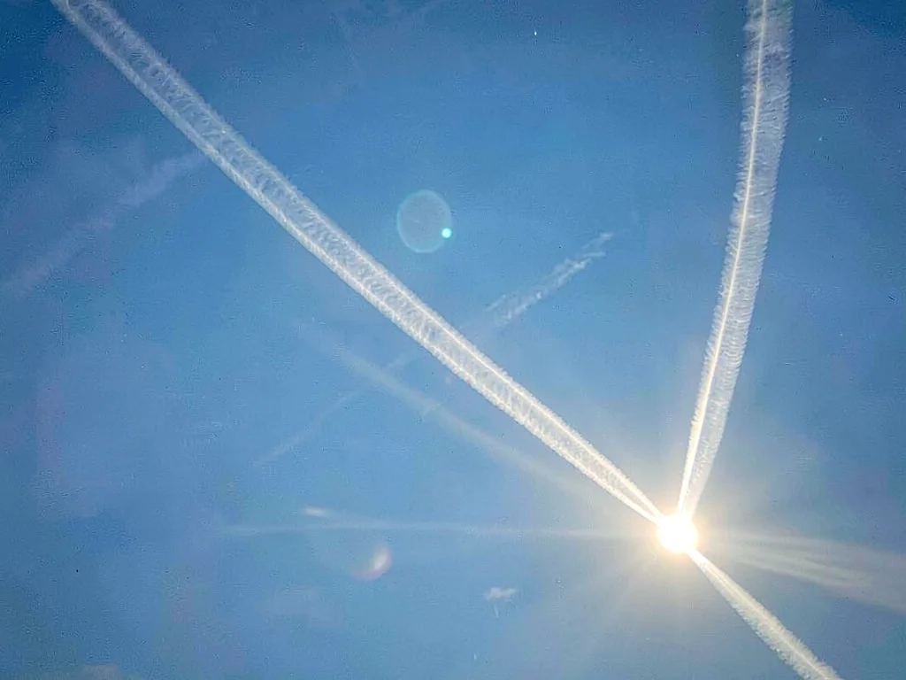 Sun dogs with tail streamers extending outward