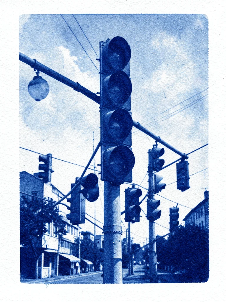 A traffic light cluster at a complex intersection with multiple signal heads