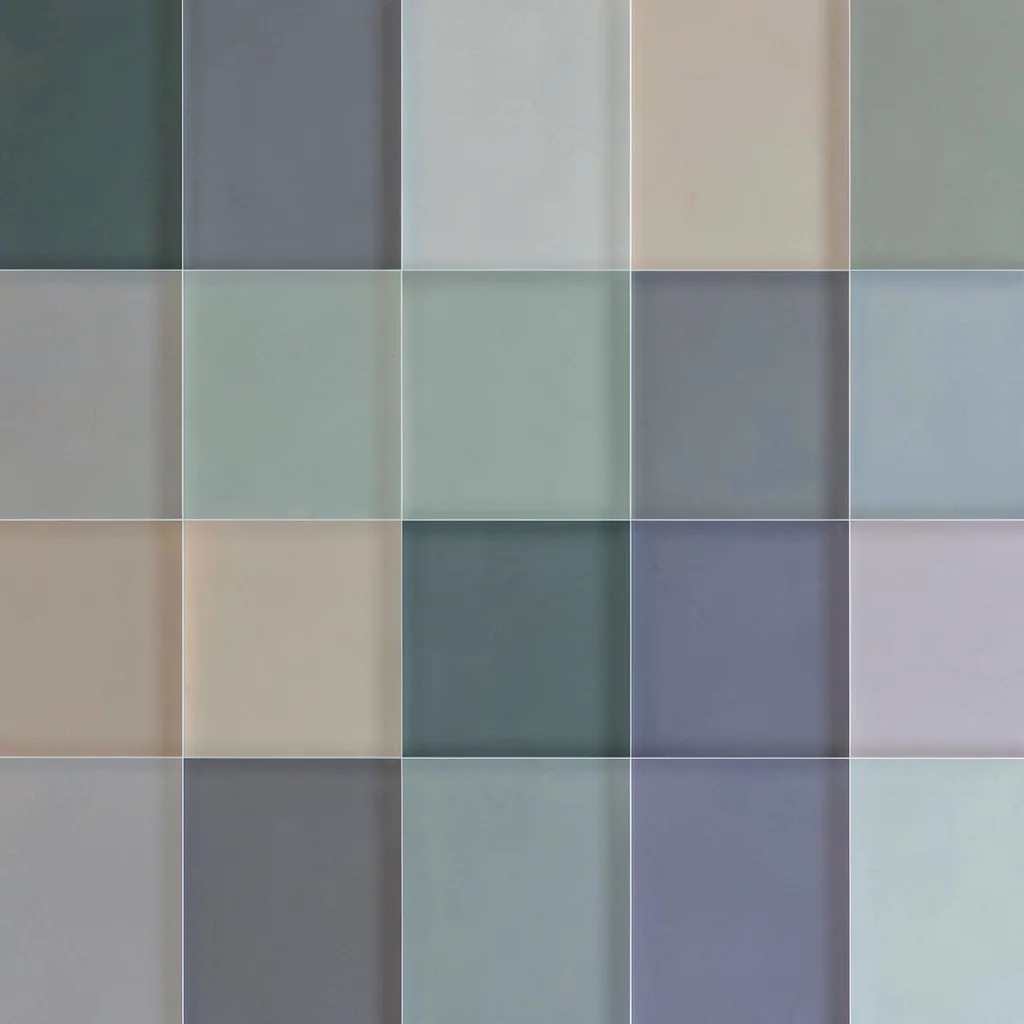 Modular grid of overlapping translucent poster rectangles in muted hues