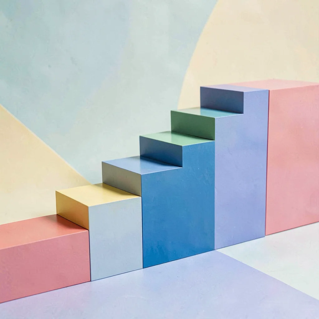 Color-block scene of paint chip cards arranged in a stepped staircase shape