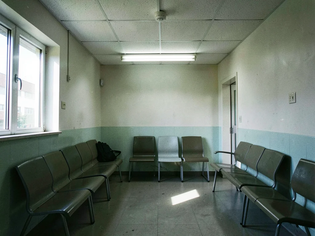 Waiting room under flat institutional lighting