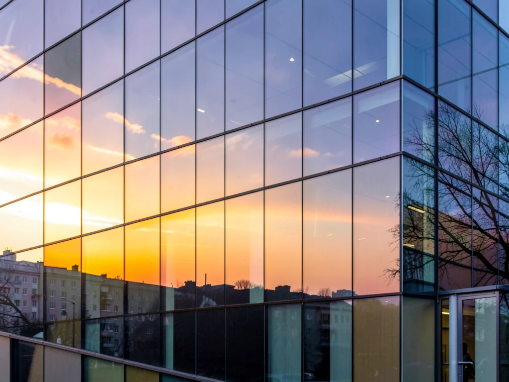 Building showing sunset reflection on one side