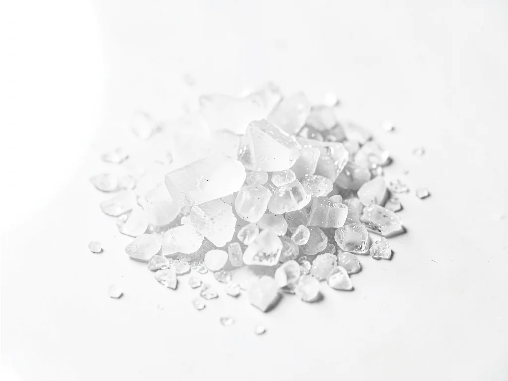 Salt crystals on white surface
