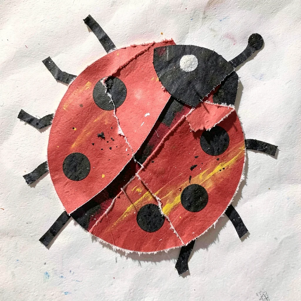 Paper collage ladybug with spots