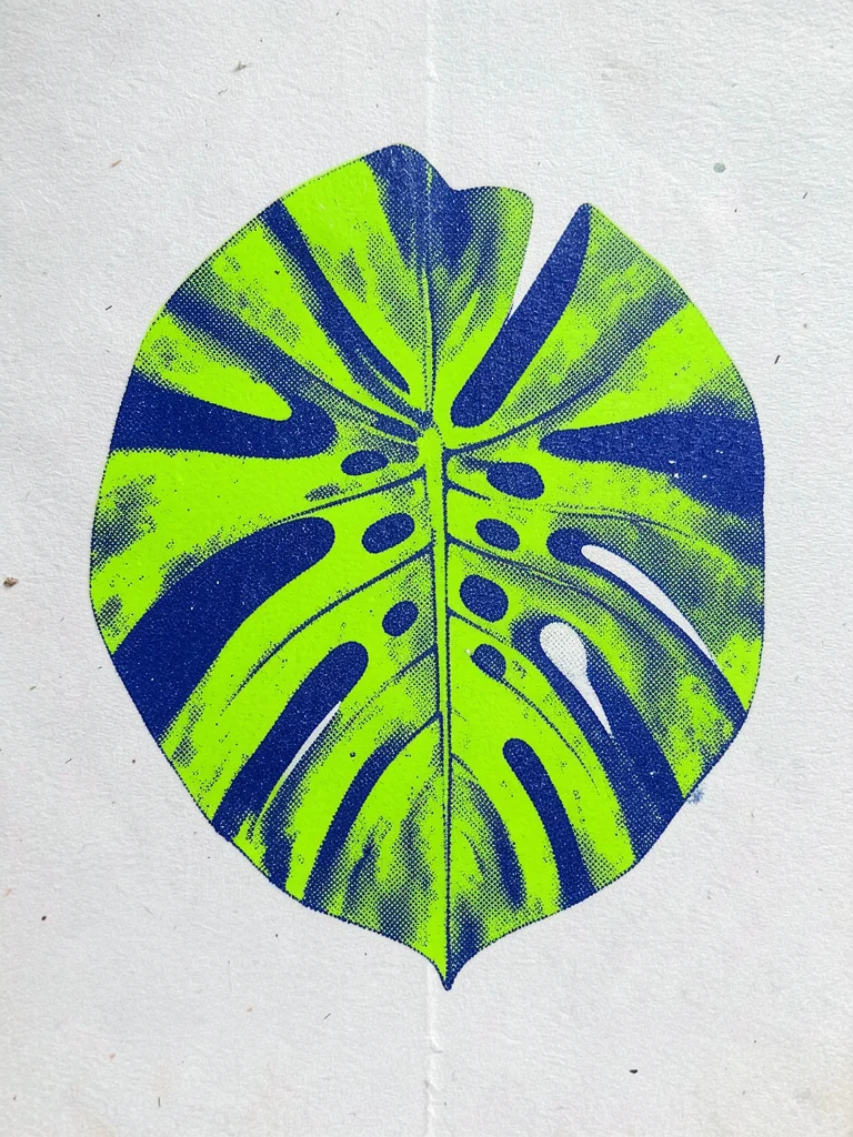 A large monstera leaf printed in fluorescent green with deep blue shadows, halft