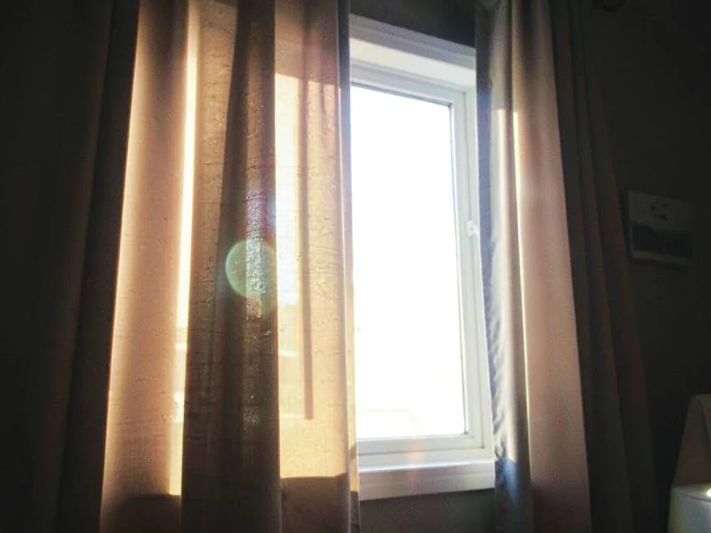Curtain with window light behind