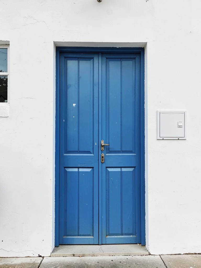 Blue door white wall