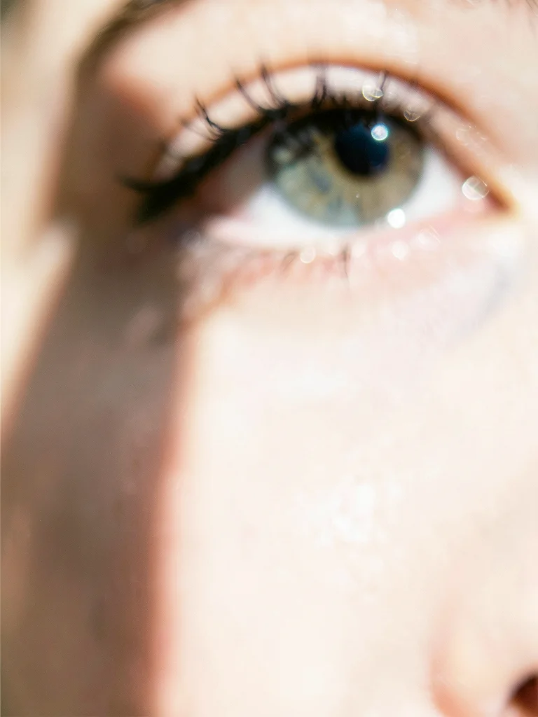 Eye close-up with catchlight, rest falling away