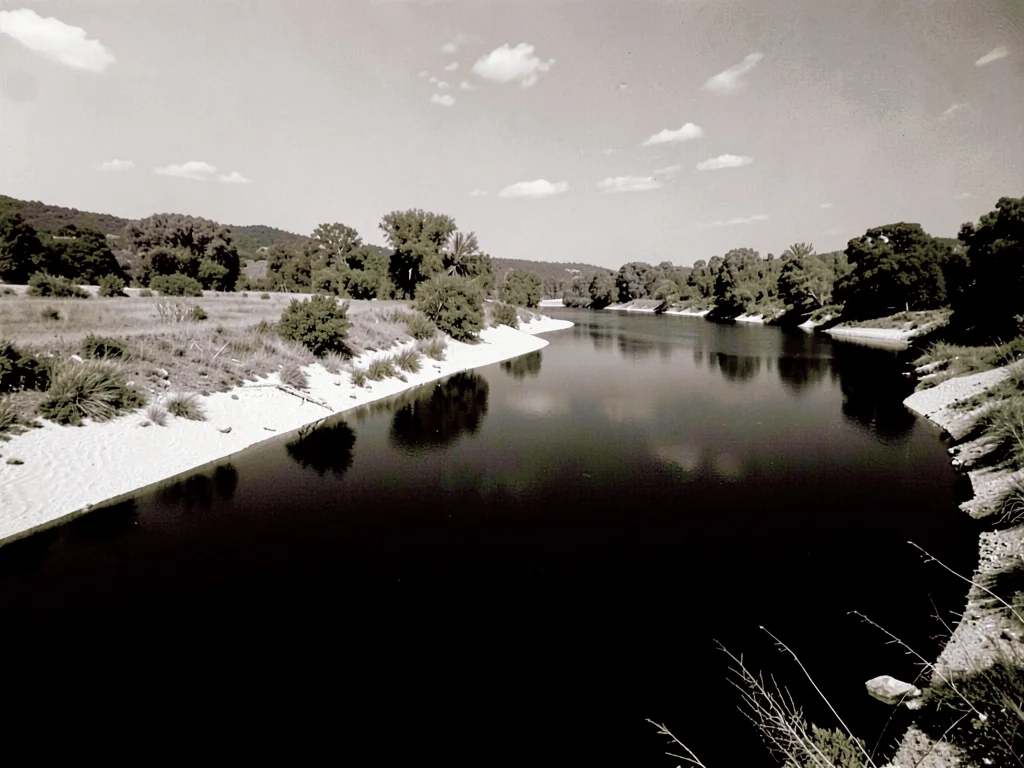 River with white banks dark water