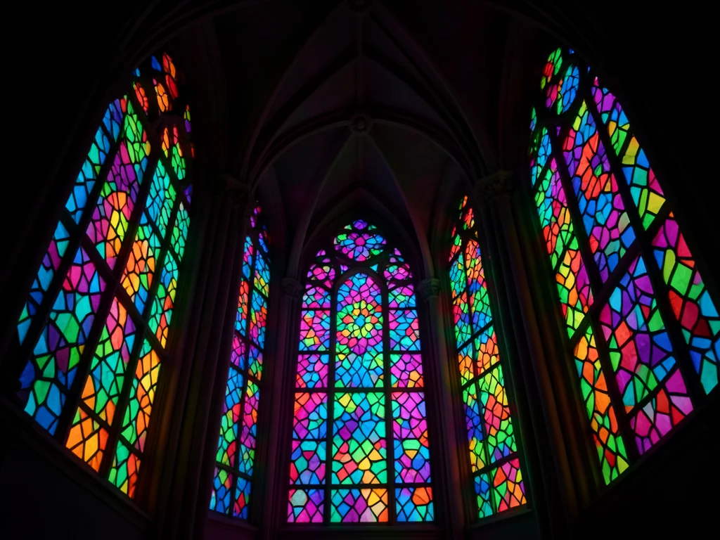 Voronoi pattern in glass, each cell a different color, backlit, cathedral-like