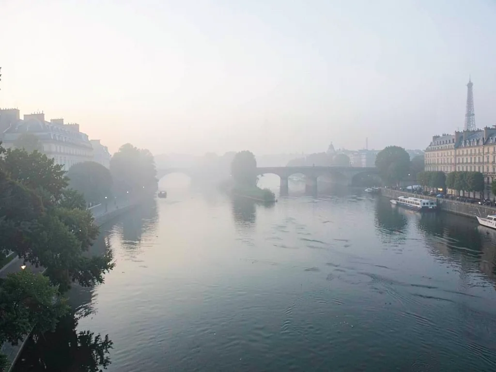 Island tip barely visible through river mist