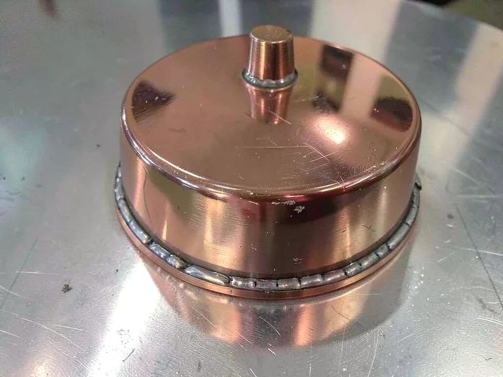 Copper still showing soldered seams
