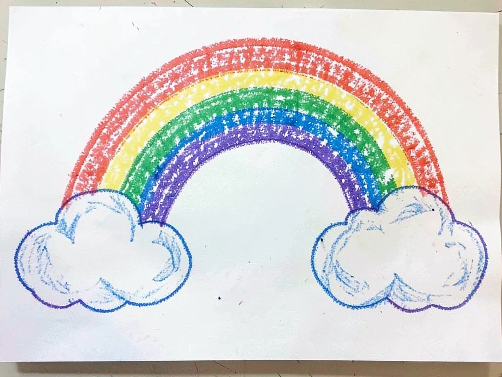 Rainbow over fluffy clouds