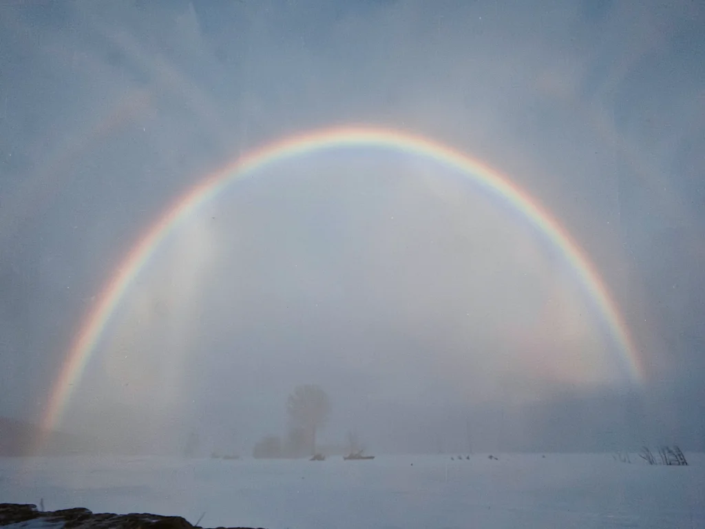Fogbow arc showing muted colors in mist