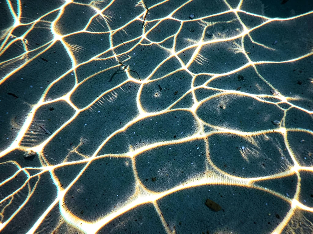 Sand ripples with caustic overlay