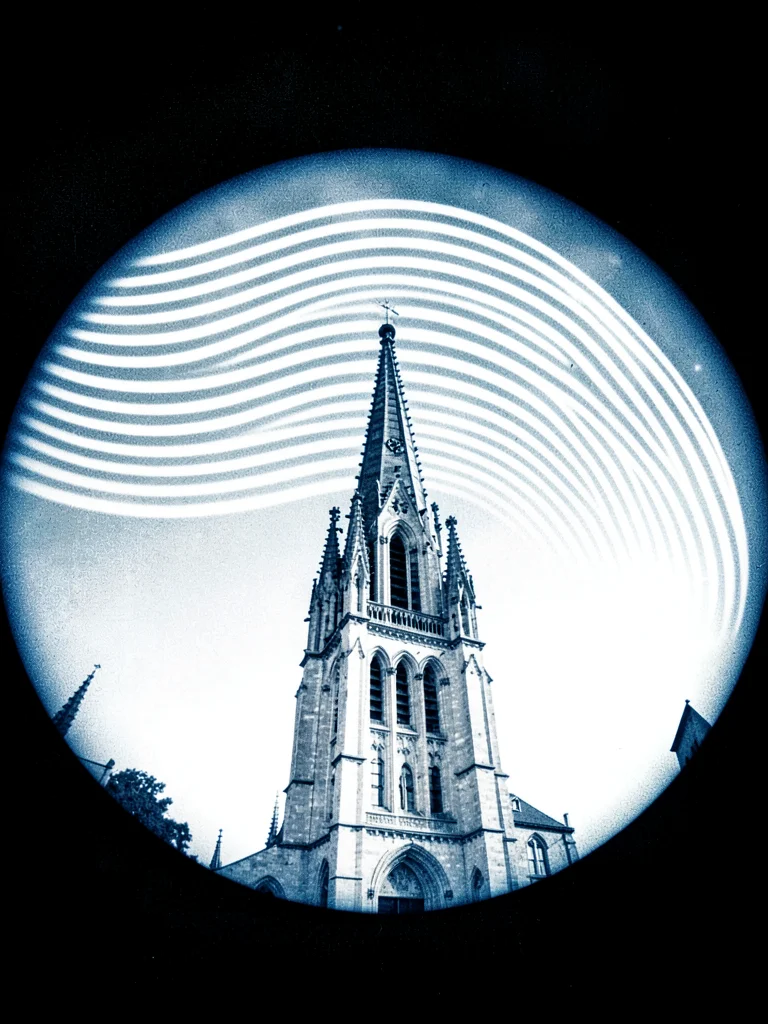 A city cathedral spire — seasonal sun arcs curving above the stonework