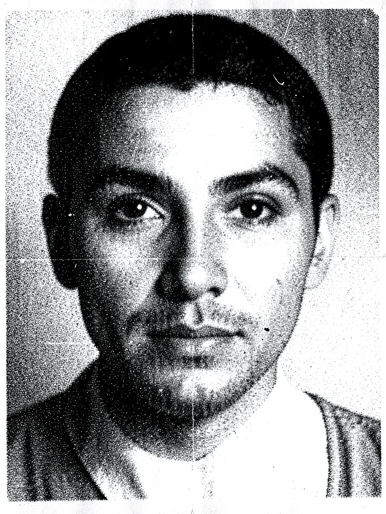 A human face degraded through 15 generations of photocopying, features barely re