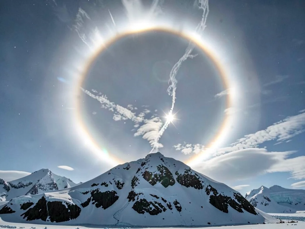 Solar halo against arctic mountain backdrop