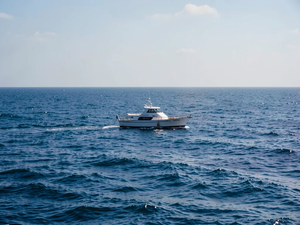 Single boat on vast sea