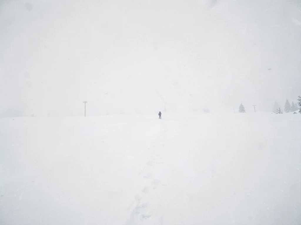 Single figure tiny in vast white