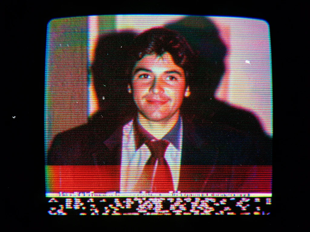 Paused tape showing head-switching noise at bottom of frame, thin band of scramb