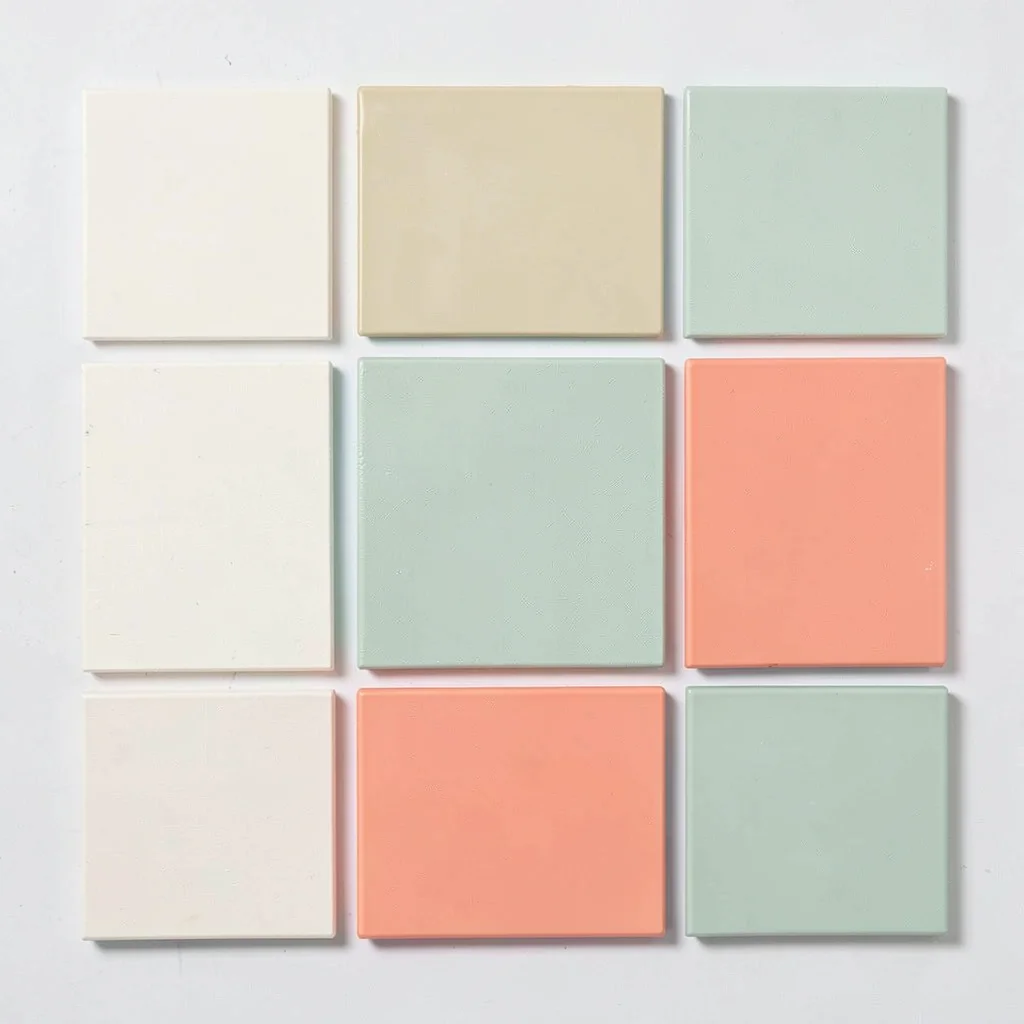 Color-block flatlay of nine paint swatches arranged in a perfect grid, cream sag