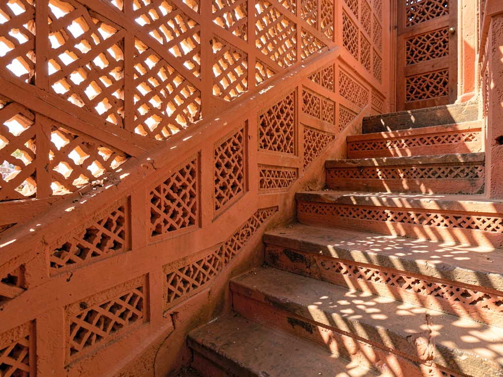 Afternoon sun through mashrabiya lattice in Lamu, Kenya, Coral stone staircase, 