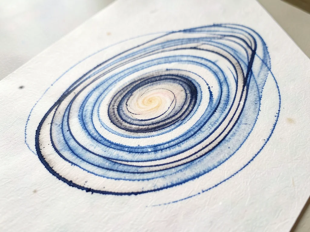 The Andromeda galaxy as an elongated oval of concentric ink rings tilted on the 