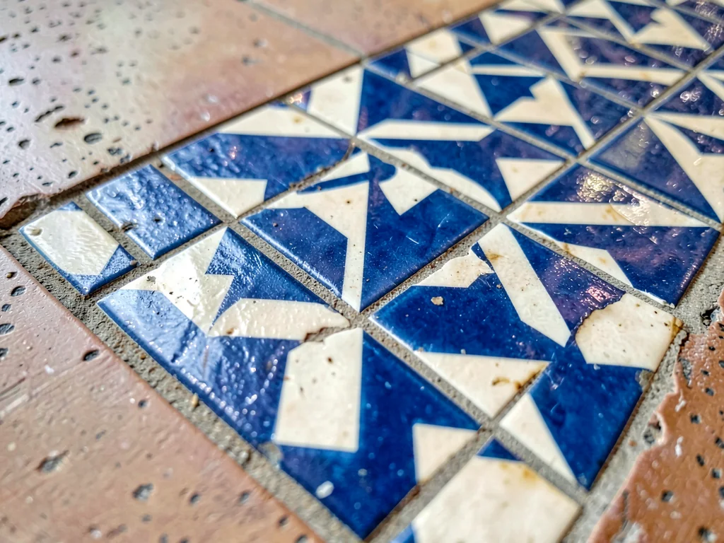 Tile pattern meeting different surface material