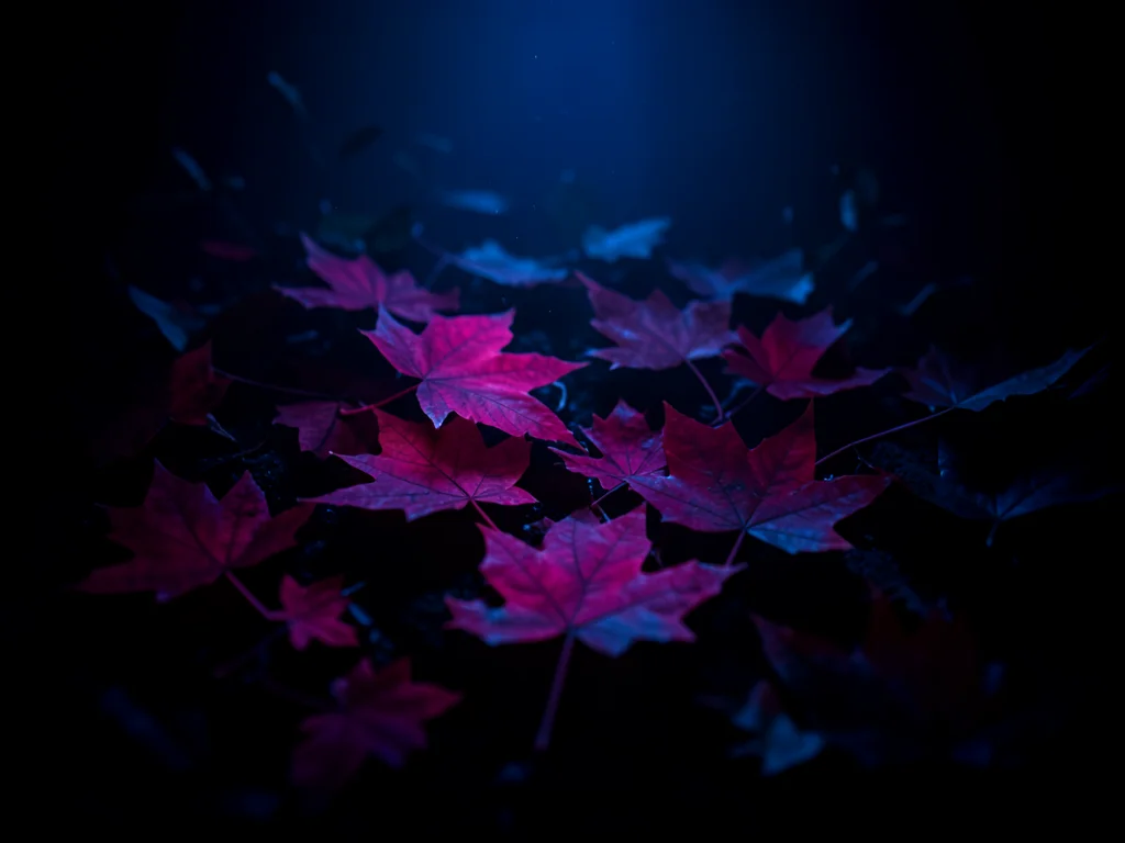 Lumen print of autumn leaves, otherworldly magenta and deep blue tones
