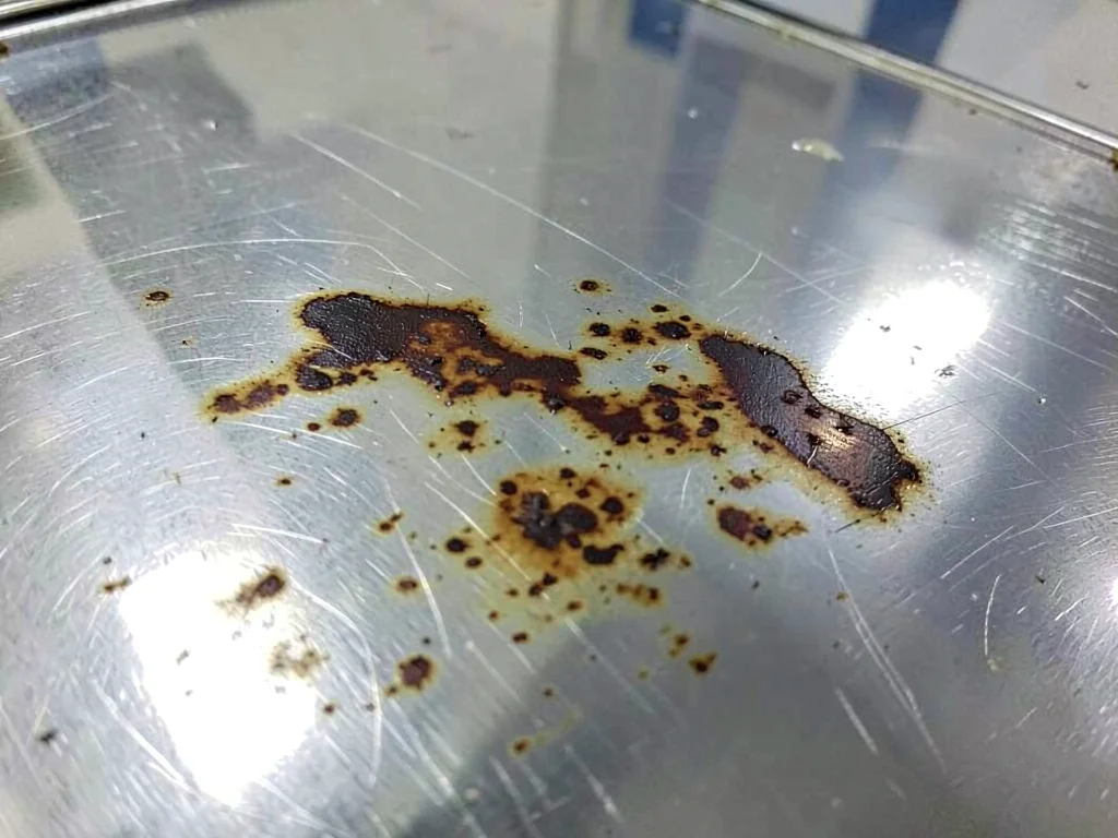 Silver surface showing tarnish pattern