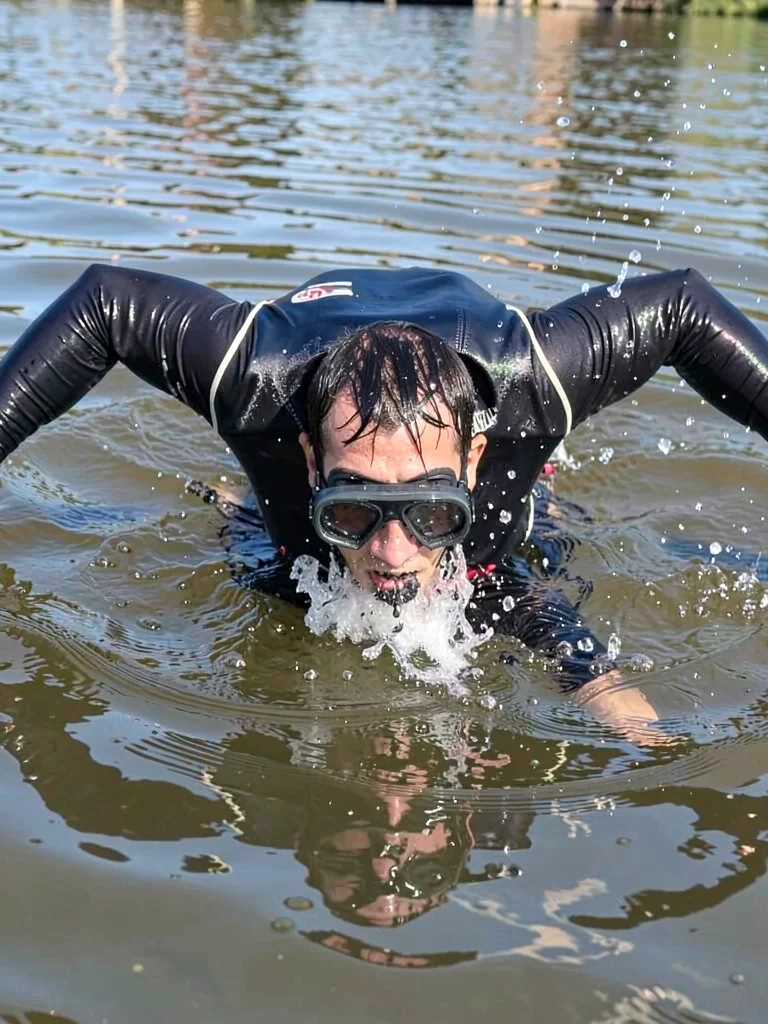 Diver entering water