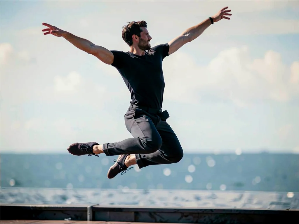 Dancer mid-leap, body replicated and shifted across frame