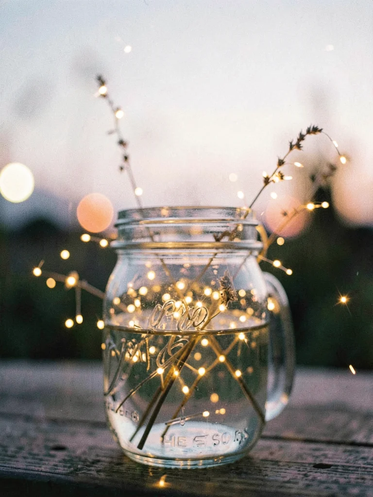 Fireflies in a mason jar at twilight