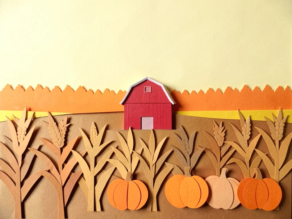 An autumn harvest: pale yellow sky, distant orange treeline, a red barn in middl