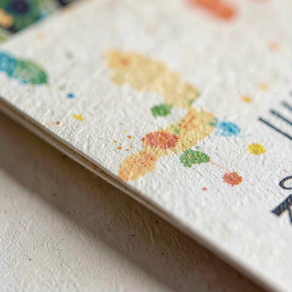 Macro of paper grain along a folded program edge with faded pigment